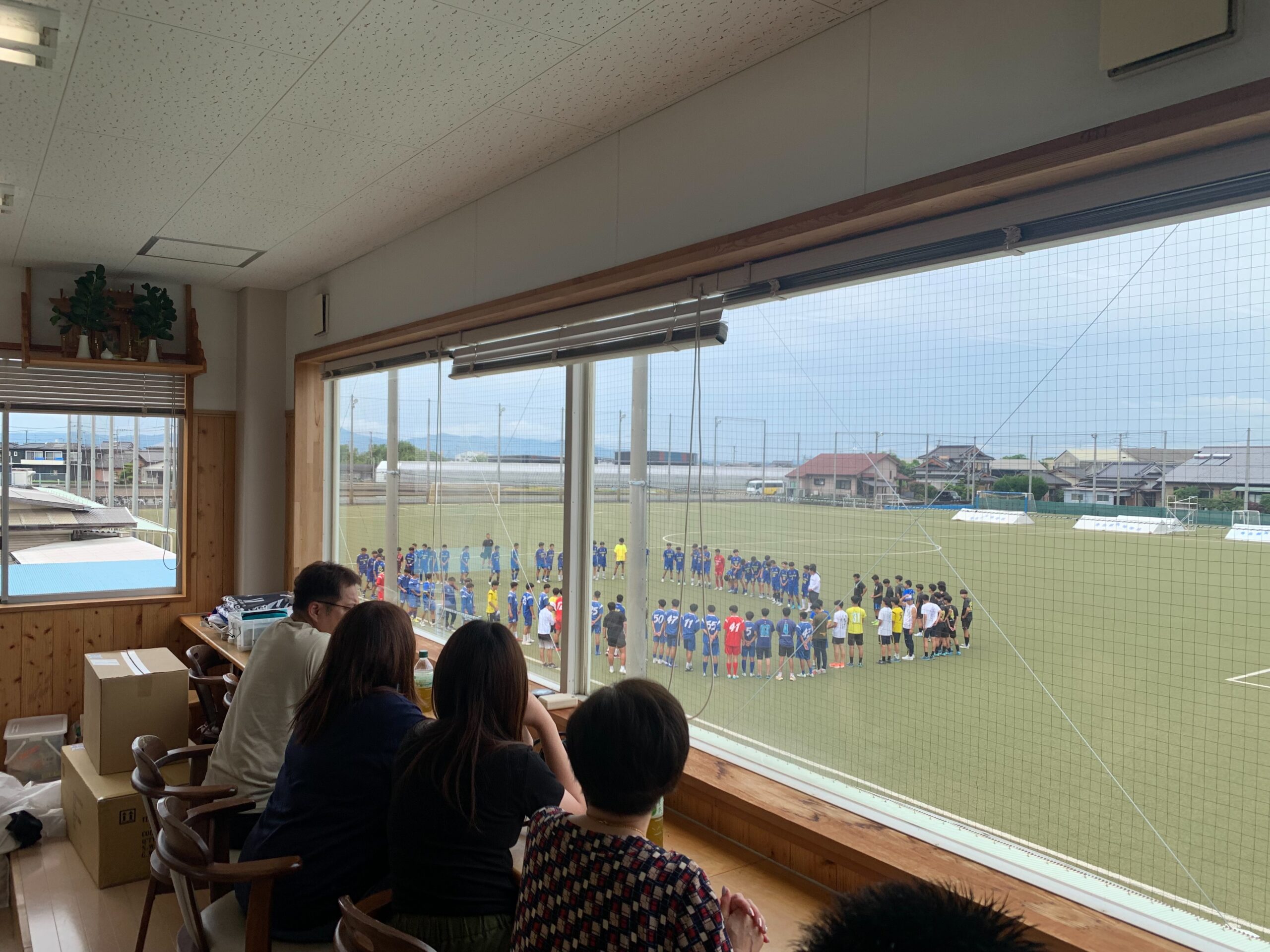 Parents watching from the clubhouse balcony
