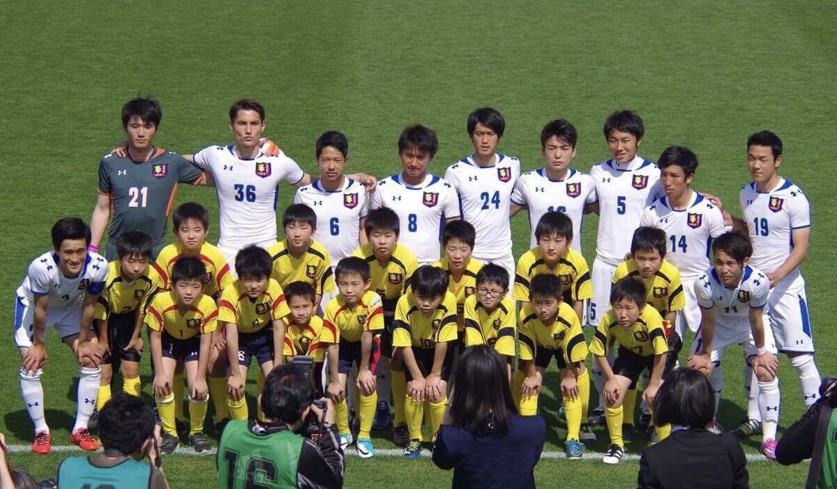 Founder with university team and youth players